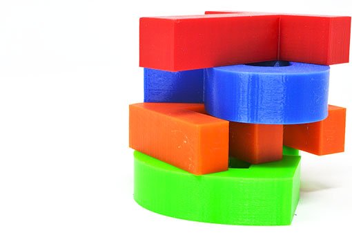 petg 3d colours PETG 3d letters stacked a top of each other, in red, blue, orange and green